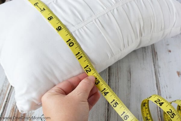 Pillow measured with tape measure.