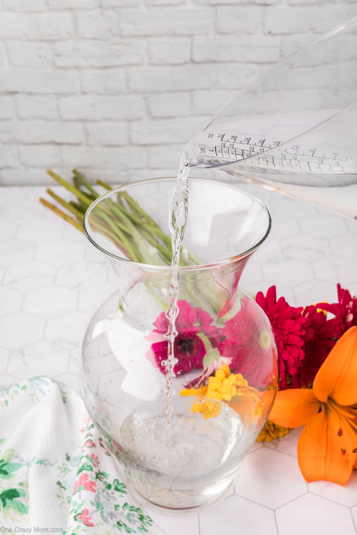 Water being poured into vase.