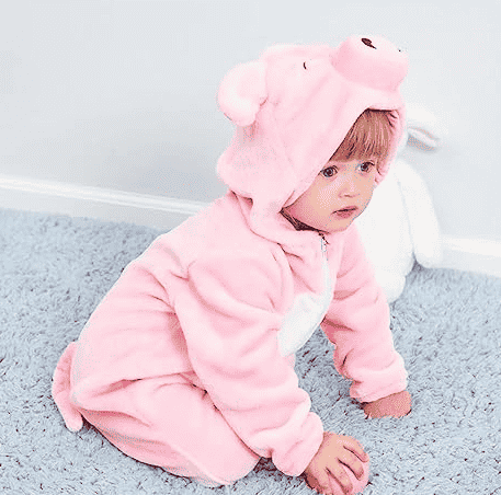 Pig Costume on child on floor.