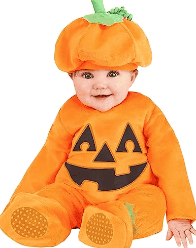 Pumpkin costume on baby sitting up.