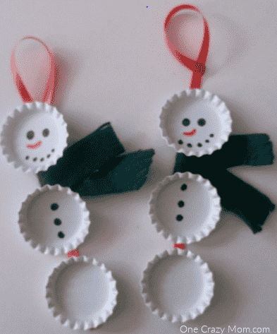 Bottle cap snowman ornaments ready to go on tree.