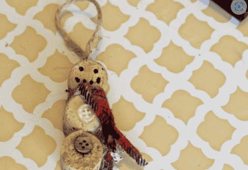 Snowman ornament with buttons.