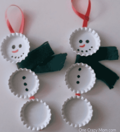 Bottle cap snowman ornaments ready to go on tree.