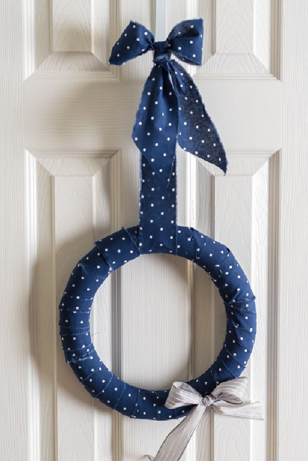 Scrap wreath with a bow.
