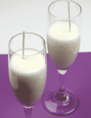 Candle in champagne glasses.
