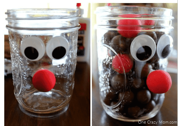 Mason jar being filled with candy.