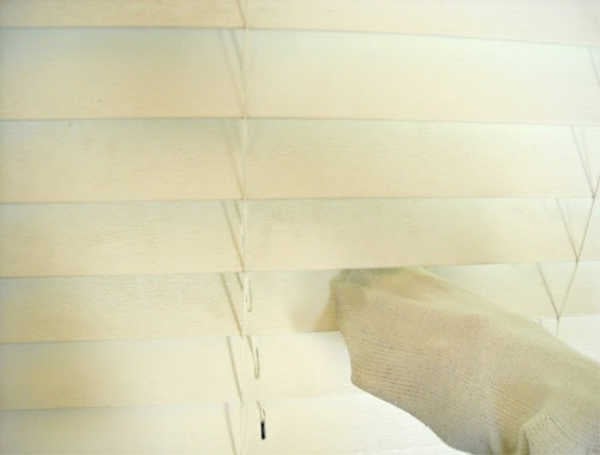 Do you need to clean your blinds but keep putting the task off? Learn how to clean blinds quickly and easily with these easy tips. Blinds being cleaned.