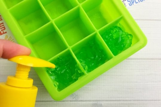 Aloe being poured into ice cubes.