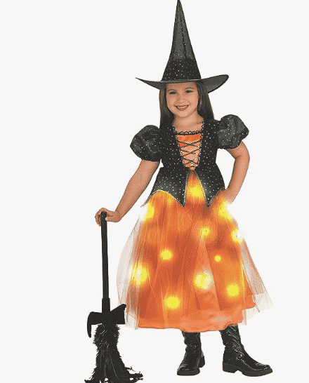 Child in witch costume with light up skirt.