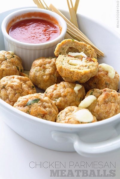 Find lots of healthy school lunch ideas here! 30 healthy back to school lunch ideas that are quick, easy and kid approved! Chicken parmesan meatballs in a white dish.
