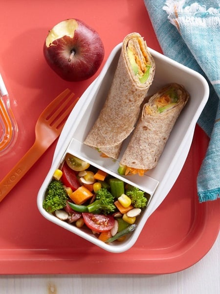 Find lots of healthy school lunch ideas here! 30 healthy back to school lunch ideas that are quick, easy and kid approved! Hummus veggie wraps in a white container.