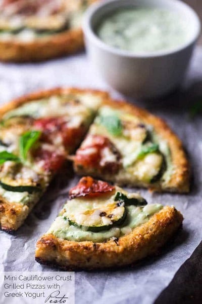 Find lots of healthy school lunch ideas here! 30 healthy back to school lunch ideas that are quick, easy and kid approved! Cauliflower pizza on parchment paper.