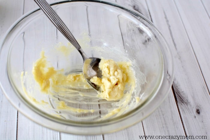 Find out how to make homemade hand cream. This easy homemade hand cream is perfect for dry skin. You only need a small amount of Homemade hand cream for dry hands to work. Try DIY hand cream today. Bowl of ingredients being combined.