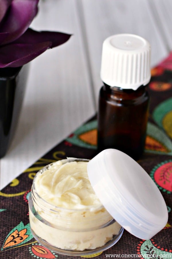 Hand cream in jar with lid beside it.