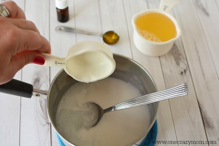 Coconut oil in pan being melted.