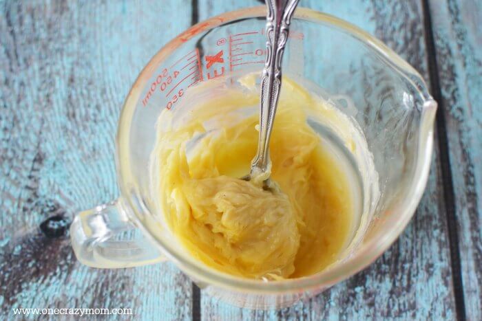Separate bowl with shea butter and beeswax.