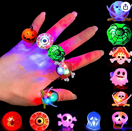 Halloween rings on a hand.