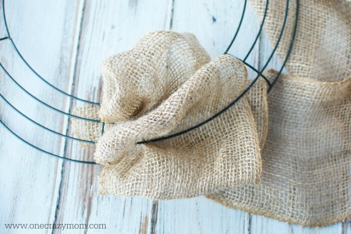 Burlap weaved in and out of wooden form.