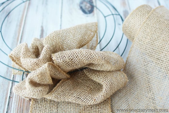 Burlap attached to wreath form.