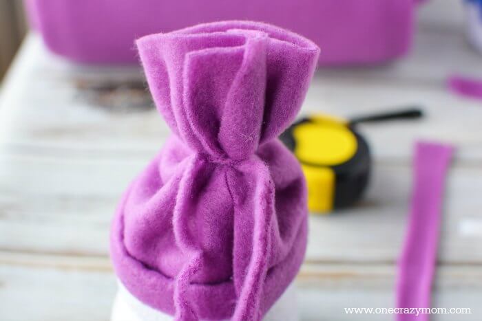 Fabric secured to create the fleece hat.