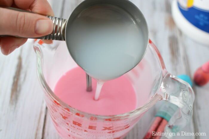Liquid starch added to glue mixture in bowl.