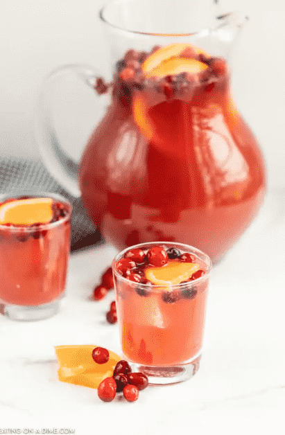 Holiday punch in pitcher and glasses.