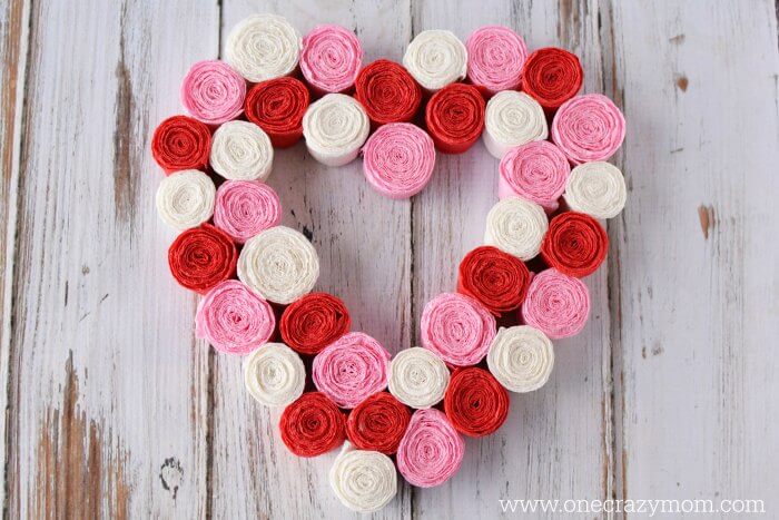 Wreath covered in paper flowers and ready to use.