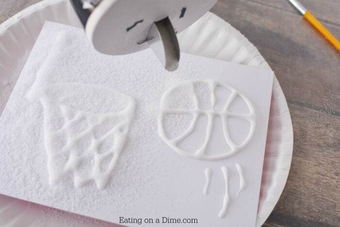 Salt sprinkled on glue design.