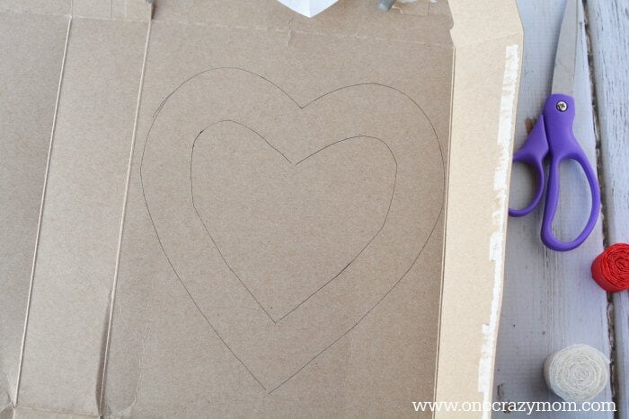 Heart on cardboard surface.