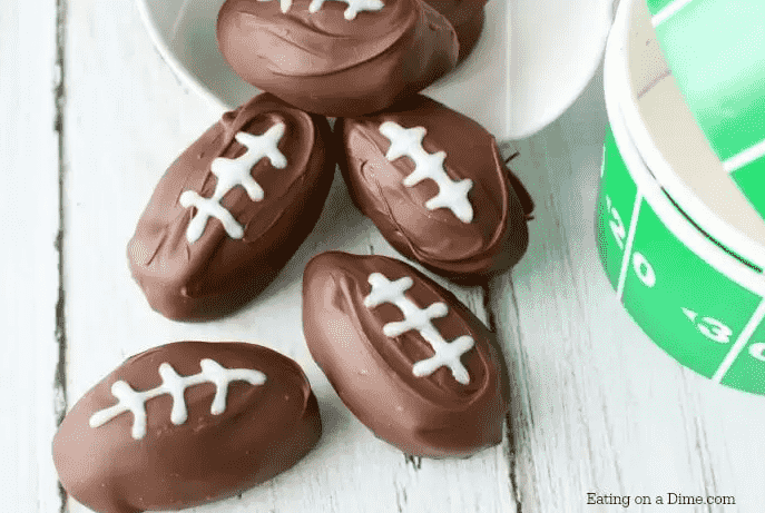 Football shaped peanut butter balls together.