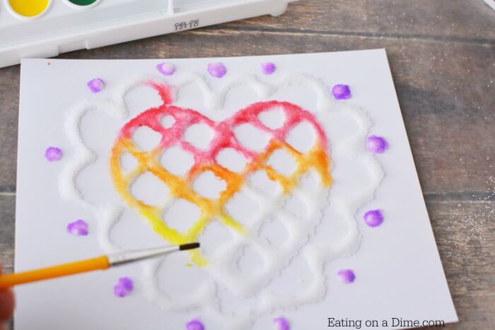 Glue being painted with various colors.