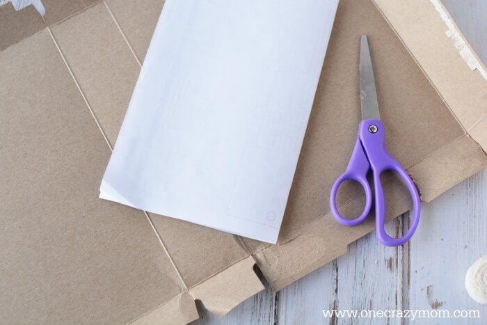 Scrap pieces of paper ready to cut into a heart.