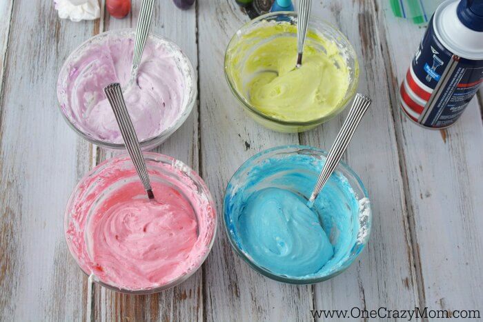 Small bowls of puff paint combined with food coloring.