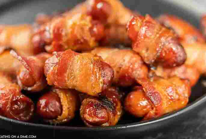 Bacon wrapped smokies on platter.