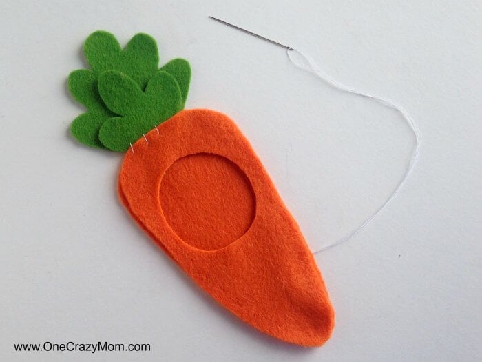 Carrot cut out and being stitched.