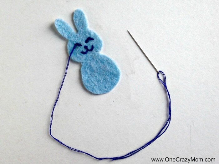 Bunny being stitched with thread.