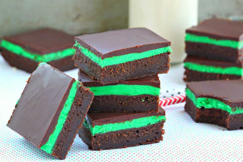 Everyone will love these fun St. Patrick's Day desserts. Find over 15 easy St Patrick's Day Desserts. Festive desserts and snack ideas sure to be a hit. Stack of Mint Chocolate Squares.