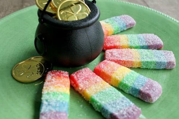 Everyone will love these fun St. Patrick's Day desserts. Find over 15 easy St Patrick's Day Desserts. Festive desserts and snack ideas sure to be a hit. Rainbow Cookies around bucket.