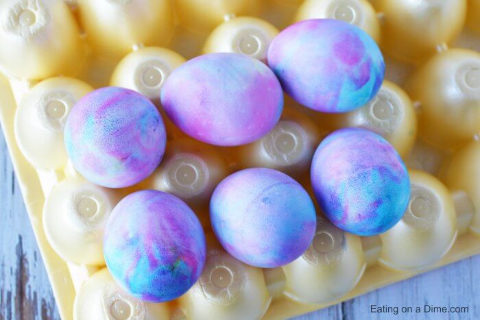 Eggs on egg carton drying.