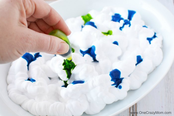Food coloring dropped in shaving cream.