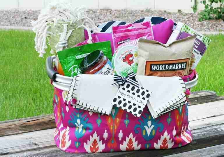 Picnic basket with snacks and plates.