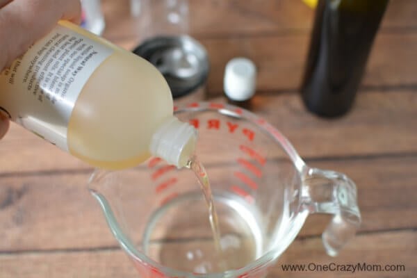 Castile soap poured into measuring cup.