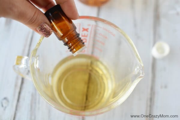 Essential oils added to measuring cup.