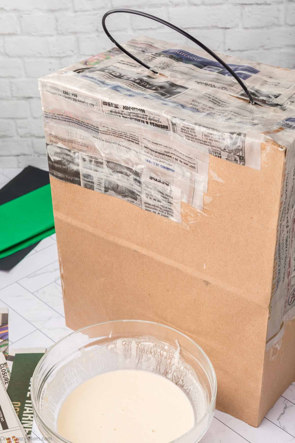 Newspaper strips placed on bag.