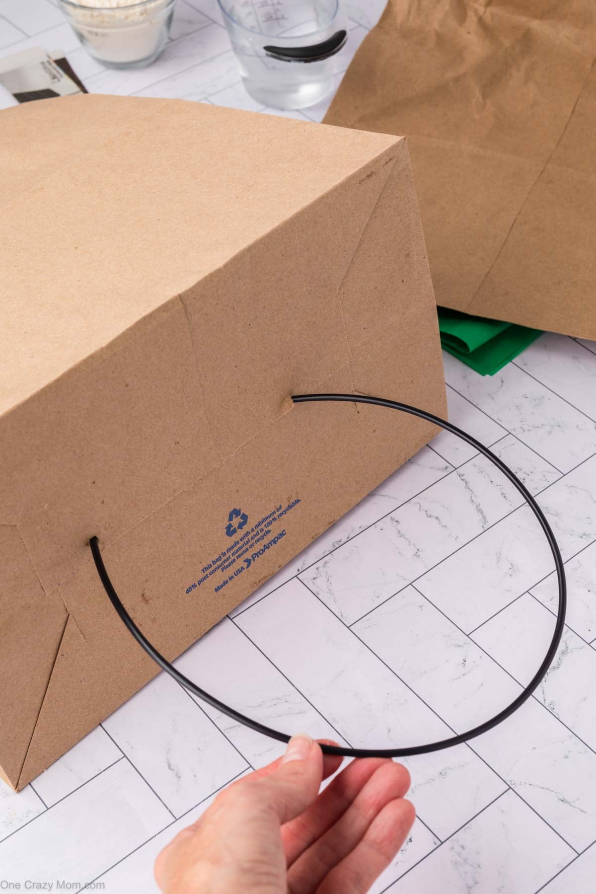 Wire attached through holes to make a handle.