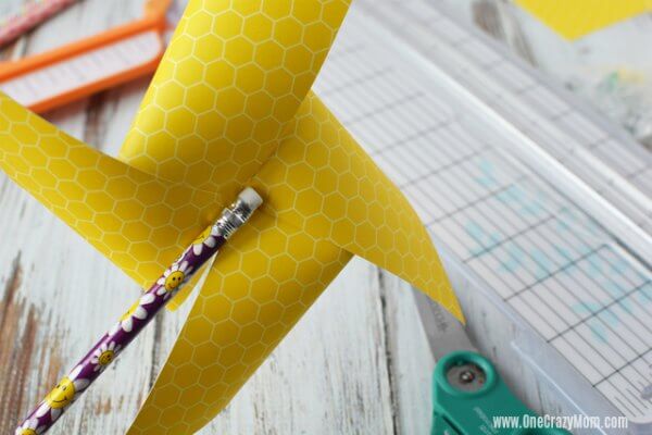 Pencil attached to pinwheel.