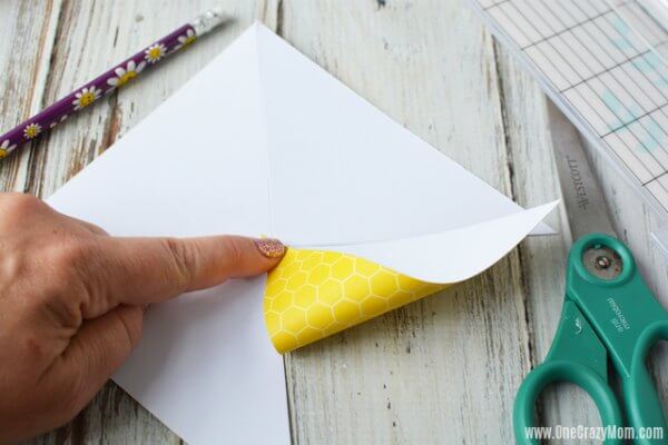 Paper folded back to make pinwheels.