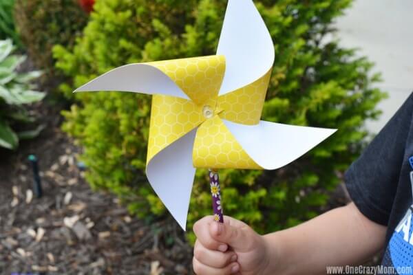 Child holding pinwheel.
