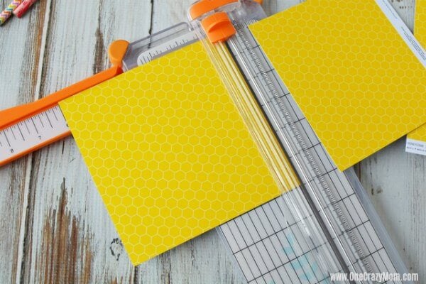 Paper trimmer cutting paper.