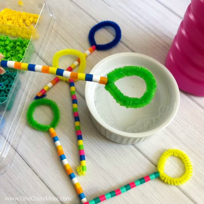 Bubble wands beside bubbles.